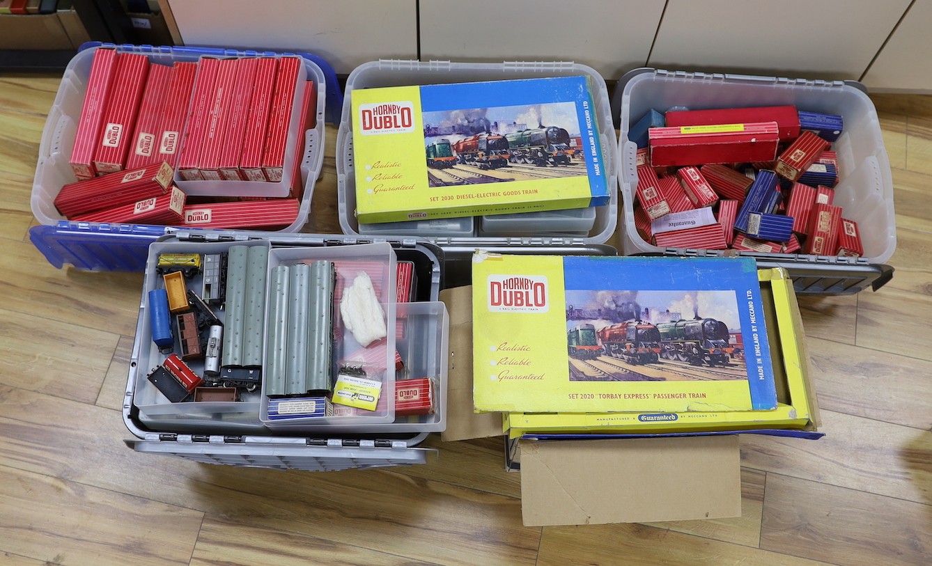 A large quantity of Hornby Dublo carriages, wagons and other rolling stock, much with original boxes, much unboxed, spare boxes which may well match, 5 boxes